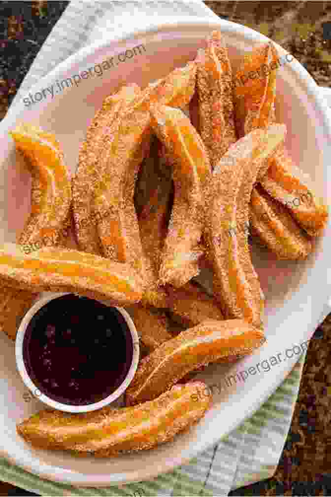 A Plate Of Freshly Made Churros, Dusted With Cinnamon Sugar And Served With A Dipping Sauce. Money Heist: Amazing Spanish Recipes To Steal: Cooking Show Competitions